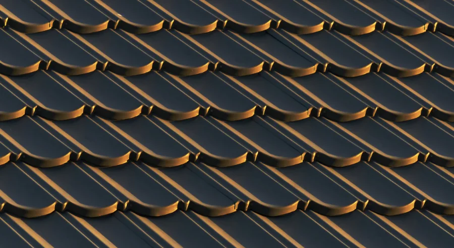 Close-up of curved clay barrel roof tiles